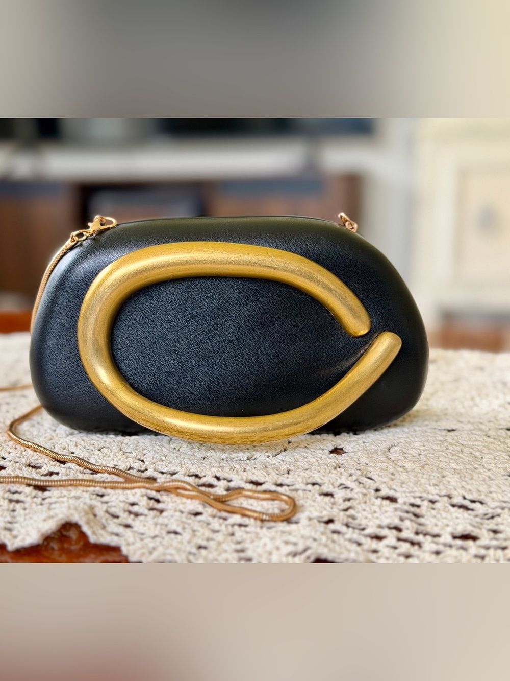 Black Leather Crossbody Clutch with Gold Accent